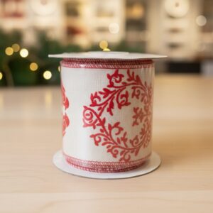 Cream-colored ribbon with  red embroidered pattern.